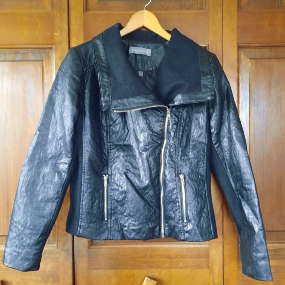 Perfectly distressed vegan leather bomber. Full zip with zip pockets.